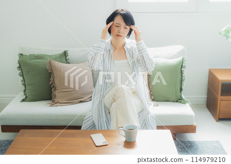 A middle-aged woman in poor health A middle-aged woman in poor health 114979210