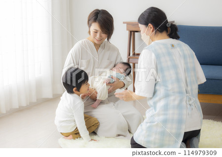 Baby and a home visit by a public health nurse 114979309