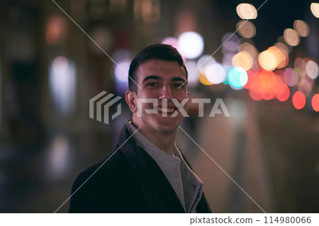Smiling Meedle Eastern man walking down street near modern office building, Smiling Meedle Eastern man walking down street near modern office building, 114980066