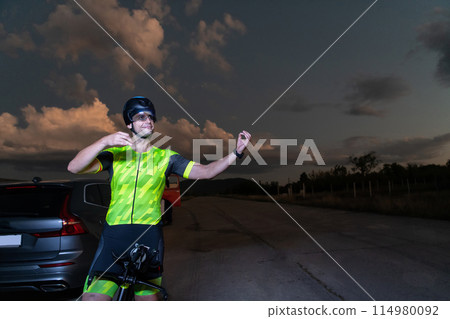 Triathlete in professional gear running early in the morning, preparing for a marathon, dedication to sport and readiness to take on the challenges of a marathon.  114980092