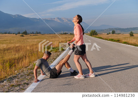 Morning Stretch: Romantic Couple Prepares for Early Morning Run Morning Stretch: Romantic Couple Prepares for Early Morning Run 114981230