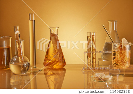 Photo for advertise product has ginseng origin with vacant space in center for product placement and plenty lab items displayed over yellow background. Photo has space for design with front view Photo for advertise product has ginseng origin with vacant space in center for product placement and plenty lab items displayed over yellow background. Photo has space for design with front view 114982538