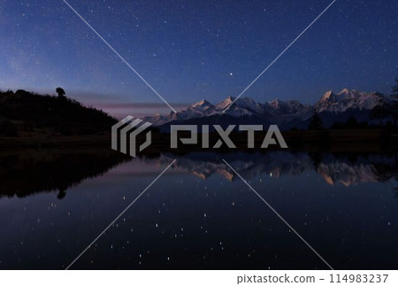 Starry Night Over Snow-Capped Mountains 114983237