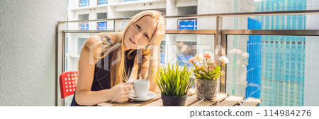 Young woman on the balcony annoyed by the building works outside. Noise concept. Air pollution from building dust BANNER, LONG FORMAT Young woman on the balcony annoyed by the building works outside. Noise concept. Air pollution from building dust BANNER, LONG FORMAT 114984276