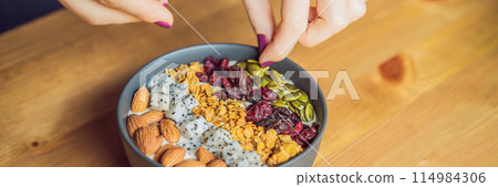 Women's hands are preparing a smoothie bowl BANNER, LONG FORMAT 114984306