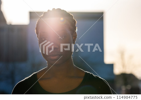 Serene Woman with Sun Flare Silhouette 114984775