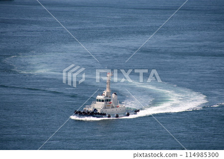 A tugboat meandering through the Kurushima Straits A tugboat meandering through the Kurushima Straits 114985300