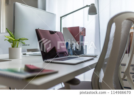 Desk with a computer 114986670