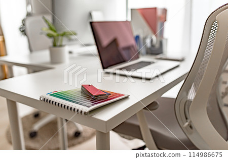 Desk with a computer 114986675