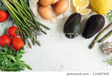 Fresh Vegetables and Eggs Arranged on a Light Surface for Healthy Cooking Fresh Vegetables and Eggs Arranged on a Light Surface for Healthy Cooking 114987005