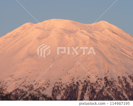 Hokkaido in winter: Mt. Yotei seen from the west side as it is dyed in the sunset Hokkaido in winter: Mt. Yotei seen from the west side as it is dyed in the sunset 114987195