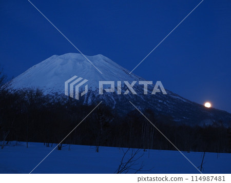 Hokkaido in winter: Mt. Yotei and the hazy moon seen from the west side of Mt. Yotei Hokkaido in winter: Mt. Yotei and the hazy moon seen from the west side of Mt. Yotei 114987481