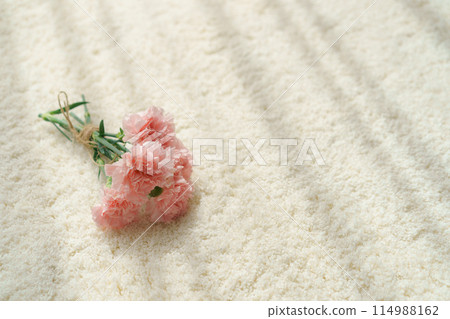 A bouquet of flowers on a rug A bouquet of flowers on a rug 114988162