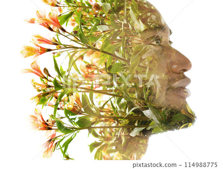 A blossoming flower double exposure profile portrait of a smiling man 114988775