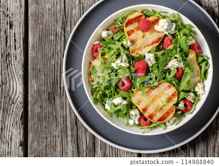 grilled pear salad with cheese, arugula, berries grilled pear salad with cheese, arugula, berries 114988840