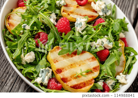 grilled pear salad with cheese, arugula, berries grilled pear salad with cheese, arugula, berries 114988841