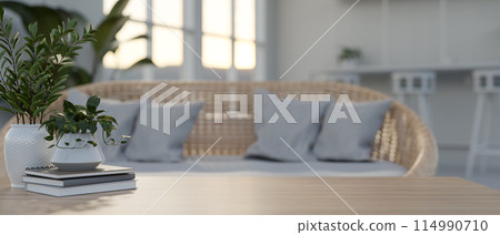 A space for displaying products on a wooden coffee table in a cozy Scandinavian living room. 114990710