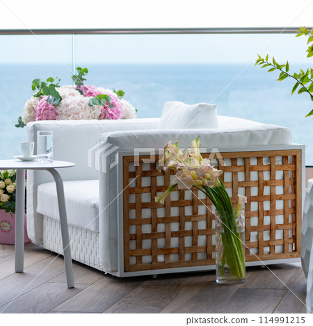 Coffee served on a beautiful terrace full of flowers 114991215