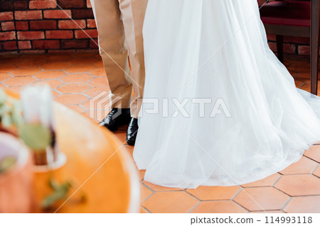 Pre-wedding photo shoot: close-up of feet Pre-wedding photo shoot: close-up of feet 114993118