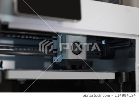 A 3d printer in the laboratory prints a structure from a polymer A 3d printer in the laboratory prints a structure from a polymer 114994154