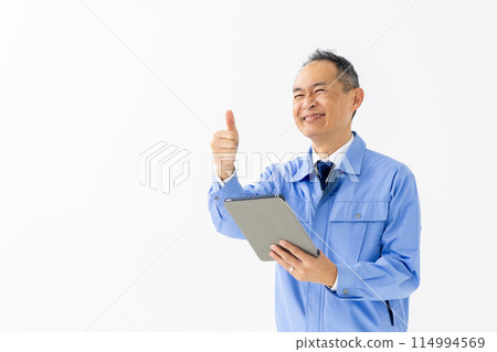 Man in work clothes, tablet, thumbs up 114994569