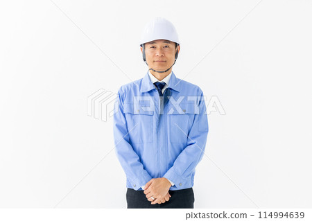Man in work clothes, helmet 114994639