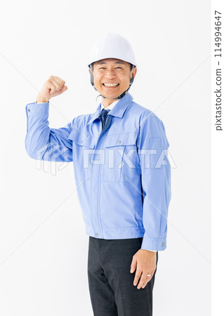 Man in work clothes, helmet, fist pump, vertical Man in work clothes, helmet, fist pump, vertical 114994647