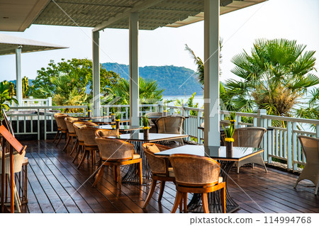 View of rooftop bar at sunset in Cape Panwa beach in Phuket, Thailand 114994768