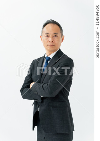 Middle-aged man, business, arms crossed, vertical Middle-aged man, business, arms crossed, vertical 114994950