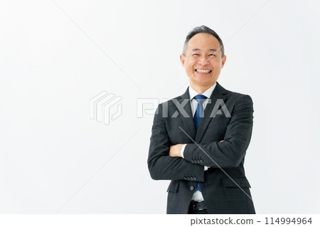 Middle male business arms crossed Middle male business arms crossed 114994964