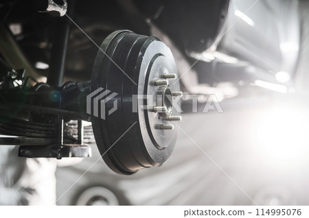 Close-up of a car's drum brakes. 114995076