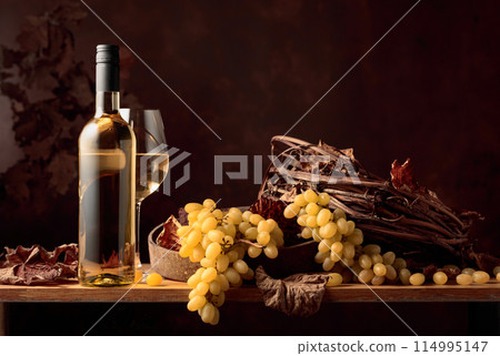 White wine and bunch of grapes. 114995147