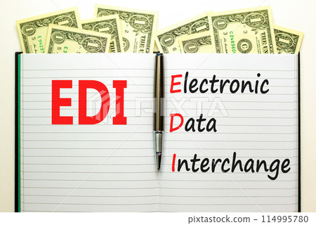 EDI electronic data interchange symbol. Concept words EDI electronic data interchange on white note. Beautiful dollar bills background. Business and EDI electronic data interchange concept. Copy space EDI electronic data interchange symbol. Concept words EDI electronic data interchange on white note. Beautiful dollar bills background. Business and EDI electronic data interchange concept. Copy space 114995780