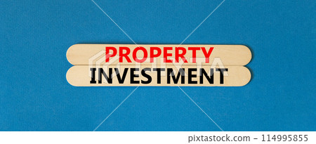Property investment symbol. Concept words Property investment on beautiful wooden stick. Beautiful blue paper background. Business Property investment concept. Copy space. Property investment symbol. Concept words Property investment on beautiful wooden stick. Beautiful blue paper background. Business Property investment concept. Copy space. 114995855