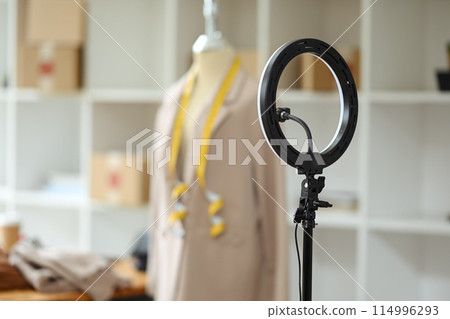 LED ring light with phone holder prepared for live streaming online clothing store on social media 114996293
