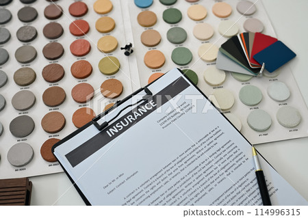 Top view contract documents and color swatches on interior designer working desk Top view contract documents and color swatches on interior designer working desk 114996315
