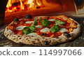 A classic Neapolitan pizza with a perfectly charred crus 114997066