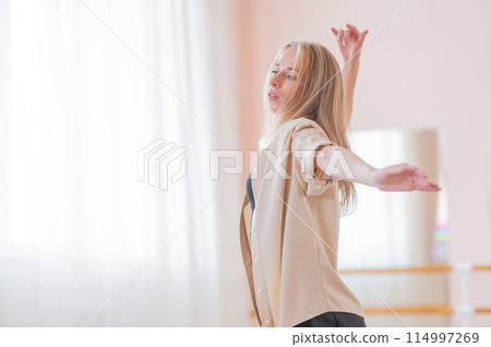 Caucasian woman dancing contemporary in ballet class. Rehearsal. 114997269