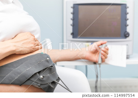 Expectant Mother Performing CTG Monitoring 114997554