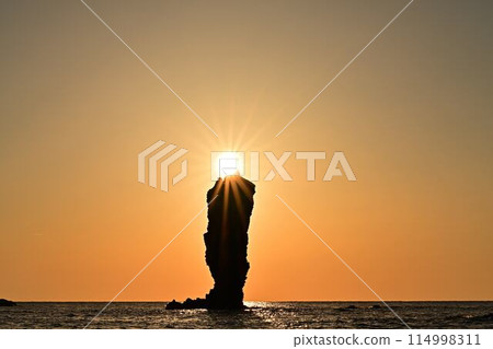 Sunset over the sea 114998311