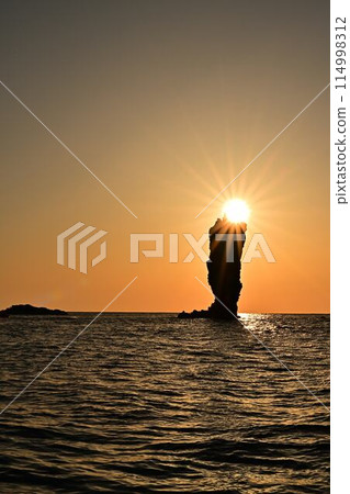 Sunset over the sea 114998312