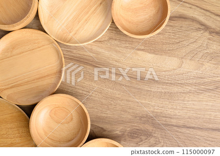 Kitchen utensils, wooden bowl, plate and dish on wooden background, Table top view 115000097