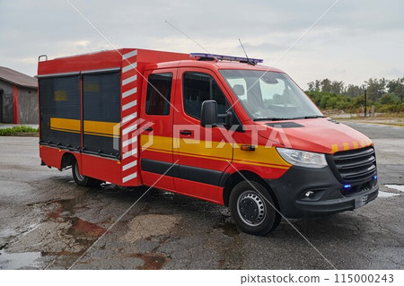 A state-of-the-art firetruck, equipped with advanced rescue technology, stands ready with its skilled firefighting team, prepared to intervene and respond rapidly to emergencies, ensuring the safety A state-of-the-art firetruck, equipped with advanced rescue technology, stands ready with its skilled firefighting team, prepared to intervene and respond rapidly to emergencies, ensuring the safety 115000243