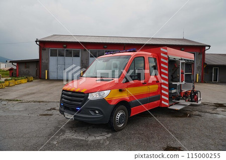 A state-of-the-art firetruck, equipped with advanced rescue technology, stands ready with its skilled firefighting team, prepared to intervene and respond rapidly to emergencies, ensuring the safety A state-of-the-art firetruck, equipped with advanced rescue technology, stands ready with its skilled firefighting team, prepared to intervene and respond rapidly to emergencies, ensuring the safety 115000255