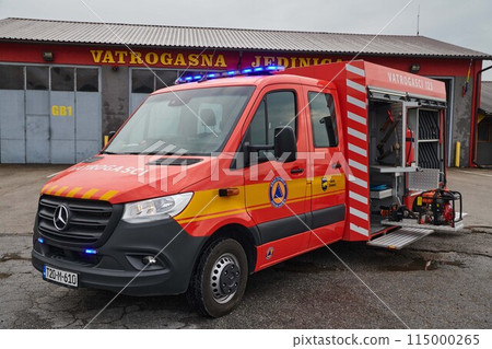 A state-of-the-art firetruck, equipped with advanced rescue technology, stands ready with its skilled firefighting team, prepared to intervene and respond rapidly to emergencies, ensuring the safety A state-of-the-art firetruck, equipped with advanced rescue technology, stands ready with its skilled firefighting team, prepared to intervene and respond rapidly to emergencies, ensuring the safety 115000265