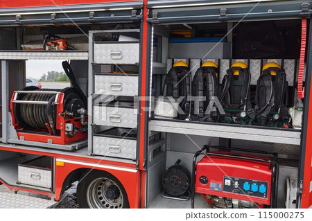 Close-up of essential firefighting equipment on a modern firetruck, showcasing tools and gear ready for emergency response to hazardous fire situations Close-up of essential firefighting equipment on a modern firetruck, showcasing tools and gear ready for emergency response to hazardous fire situations 115000275