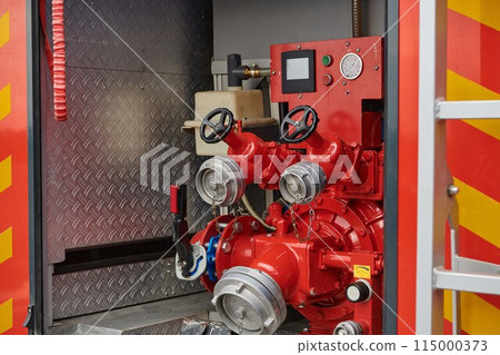 Close-up of essential firefighting equipment on a modern firetruck, showcasing tools and gear ready for emergency response to hazardous fire situations 115000373