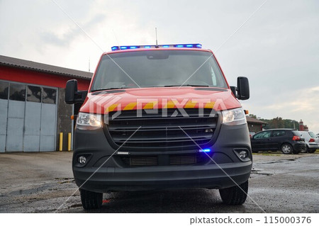 A state-of-the-art firetruck, equipped with advanced rescue technology, stands ready with its skilled firefighting team, prepared to intervene and respond rapidly to emergencies, ensuring the safety 115000376