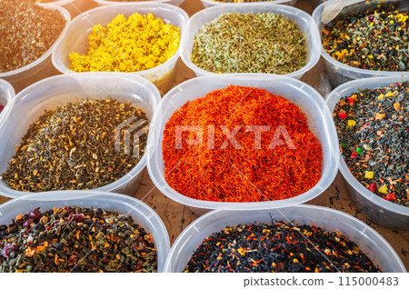 assortment of various oriental herbal and flower teas on spice bazaar on counter in Uzbekistan assortment of various oriental herbal and flower teas on spice bazaar on counter in Uzbekistan 115000483