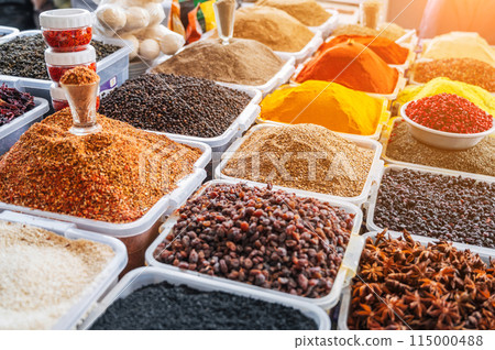 assortment of various oriental spices on the counter at Asian bazaar in close-up 115000488